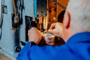 Man repairs an appliance